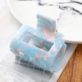 Detailed macro view of the rectangular acetate hair claw with blue and pink floral patterns - 7145-7 Lake Blue Floral