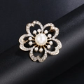 Golden sun flower pearl brooch with crystal petals on a black jewelry stand - Gold 5-Petal Flower Pearl
