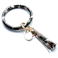 Macro shot of PU leather keychain bracelet with skull and floral pattern detail - Bull Head Rose