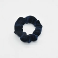 Detailed close-up of dark blue velvet fabric texture on a soft elastic hair scrunchie - Dark Blue