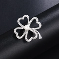 Silver four-leaf clover brooch with white rhinestones and a central pearl accent - Silver Clover Pearl