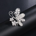 Exquisite silver-colored butterfly brooch with pavé rhinestones on a display stand - Silver Pave Butterfly