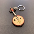 Traditioneller chinesischer Instrument-Schlüsselanhänger aus rotem und beige PVC - Zhongruan