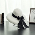 Detail of white woven sun hat with wide brim and elegant black ribbon bow accessory - M (56-58cm) / Bleached White