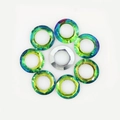 Blue-green gradient glass halo beads arranged around a central silver ring - Green