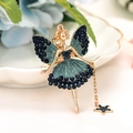 Gold angel keychain with blue rhinestones and star pendant on a white plate - Dark Blue