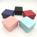 Square paper watch gift boxes in five colors arranged in a circle on white background - Watch Box
