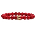 Red turquoise bead bracelet set with a detailed gold crown charm on white background - Red Turquoise Gold Crown