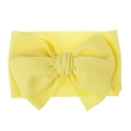Detailed macro shot of bright yellow waffle knit fabric baby headband with large bow tie - Pre-tied Bow / Bright Yellow