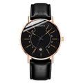 Detailed macro view of the rose gold bezel and black leather strap of this quartz watch - Black Dial Rose Gold Case Black Strap Orange Hands