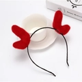 Christmas plush reindeer antler headband in vibrant red on a stylish lifestyle background - Dark Red