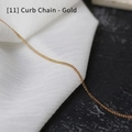Close-up of golden stainless steel curb chain on elegant white and black texture - Curb Chain / 60 cm / Gold