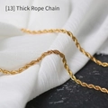Close-up of thick gold-plated twisted rope chain necklace on a stone display - Thick Twist Chain / 70 cm / Gold