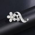 Silver sunflower brooch with pearls and rhinestones on a dark textured display - Silver 5-Petal Flower Streamline