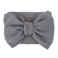 Detail showing grey waffle knit texture on infant bow headband with soft elastic fabric - Pre-tied Bow / Dark Gray