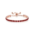 Adjustable rose gold crystal bracelet featuring a single row of red round gemstones - Rose Gold + Red Zirconia