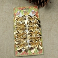 Set of 12 gold textured bow ornaments for Christmas tree decor on burlap background - Gold