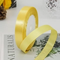 Vibrant lemon yellow satin ribbon roll for gift wrapping and wedding decor on white core - Light Gold