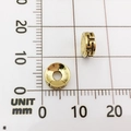 Macro view of golden alloy elephant spacer beads with Greek fret pattern on grid scale - Swastika Pattern Bead (10142)