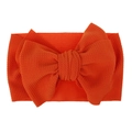 Detailed view of bright orange waffle knit fabric on a large bow baby headband - Pre-tied Bow / Orange