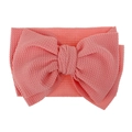Detailed view of baby headband featuring coral waffle-textured knit fabric and large bow - Pre-tied Bow / Dusty Pink