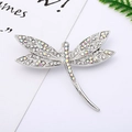 Macro detail of a dragonfly brooch with sparkling crystals and silver wing patterns - 29# Silver Dragonfly