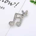 Close-up of a silver music note brooch with rhinestones and a colorful butterfly - 13# Butterfly Musical Note