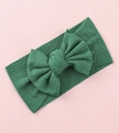 Macro detail of dark green ribbed knit baby headband with a large decorative bow - Dark Green
