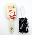 Beige Christmas themed cartoon hair brush with festive Santa pattern and white handle - Yellow Santa Claus