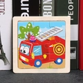 Educational 9-piece wooden jigsaw puzzle featuring a bright red cartoon fire truck - Fire Truck