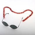 Close-up of red marble acrylic chain strap attached to black metal sunglasses - Red Marble (9)