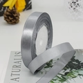 Glossy silver gray satin ribbon on foam roll for gift wrapping and wedding decor - Gray