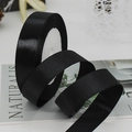 Roll of black satin ribbon with elegant curls for gift wrapping and wedding decorations - Black