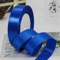 Deep blue satin ribbon on a white spool for luxury gift wrapping and DIY crafts - Royal Blue