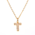 Macro shot of gold-plated initial T pendant necklace with sparkling micro-pave crystals - Letter T