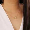 Close-up of gold star pendant with small crystals worn on a delicate O-link chain - 5# Jelly Color
