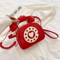 Creative red retro telephone shaped crossbody bag with glossy finish and heart dial - Red