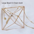 Detail of gold satellite chain with small solid beads on a metal display stand - Large Bead O-Chain / 45 cm / Gold