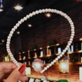 Detailed view of handmade bridal headband with woven cream pearls on a slim metal frame - 16# Creamy White Single Row Pearls