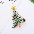 Detailed close-up of a Christmas tree enamel brooch with colorful rhinestones and gold trim - 11# Christmas Tree