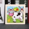 Wooden puzzle for kids featuring a cartoon cow, yellow chicken, and red windmill - Cow
