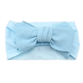 Light blue waffle textured baby headband featuring a large bow on a white background - Blue
