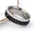 Detail of silver stainless steel ring featuring a rotating black Cuban chain inlay - US 6 / 8MM Chain Ring Black