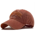 Vintage washed cotton baseball cap in rust orange with New York embroidery 45-degree view - Adjustable / Orange
