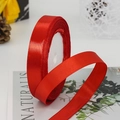 Vibrant red satin ribbon roll with silk sheen for gift wrapping and wedding decor - Red
