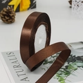 Dark brown satin ribbon roll for gift wrapping and DIY crafts with a silky finish - Coffee