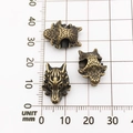 Antique bronze alloy lion head beads for DIY jewelry making on a measuring mat - Antique Bronze Wolf Head