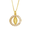 Detailed macro of a gold Virgin Mary heart pendant with baguette-cut zircon crystals - Baguette Ring Virgin Mary