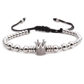 Detail of silver beaded bracelet with sparkling crown charm and adjustable black cord - Crown Bracelet / White Gold