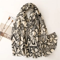 Elegant floral print beige shawl for women with soft frayed edges and modern abstract design - Beige